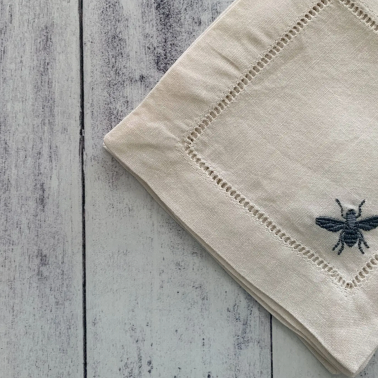 picture of a linen coaster with a bee
