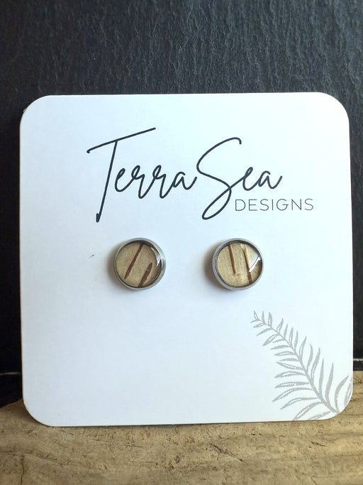 Wooden earrings on a 'TerraSea Designs' branded card with a dark background.