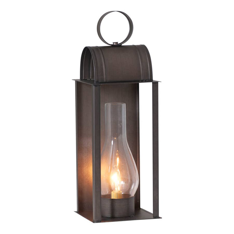 Decorative lantern with a lit candle inside on a white background