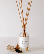 Diffuser with reeds labeled 'Hello Fall' on a white background