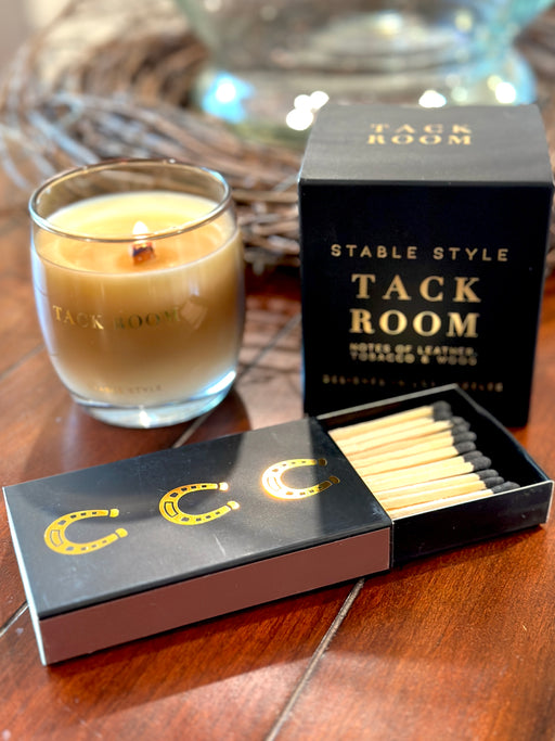 box f matches with horsec shoes and a candle in the background