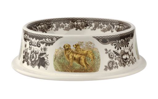 A ceramic pet bowl with a floral and animal pattern, featuring a Woodland theme with dogs and flowers on the exterior.