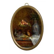 Still life painting with fruits and a vase in an oval frame