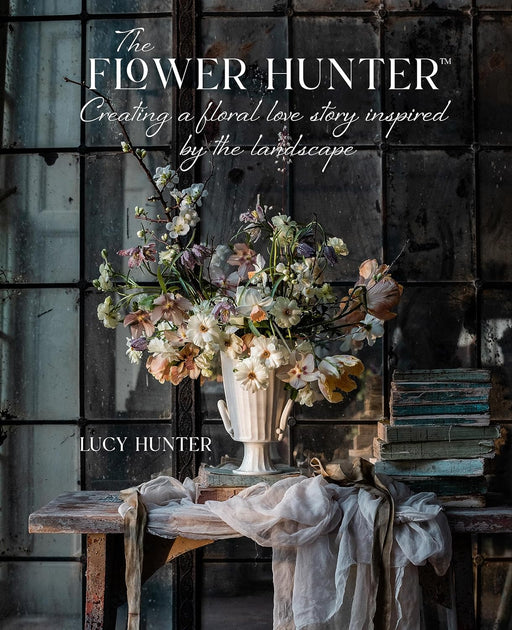 Book cover of 'The Flower Hunter' by Lucy Hunter with a vase of flowers on a wooden table.