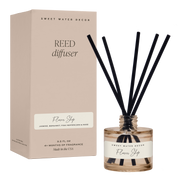 Reed diffuser with black sticks and a beige box labeled 'Sweet Water Decor' on a white background.