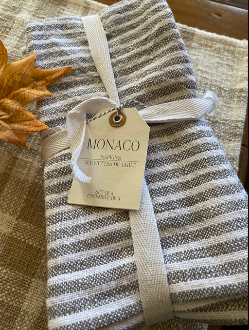 a set of four soft stone washed striped napkins in pewter and white.