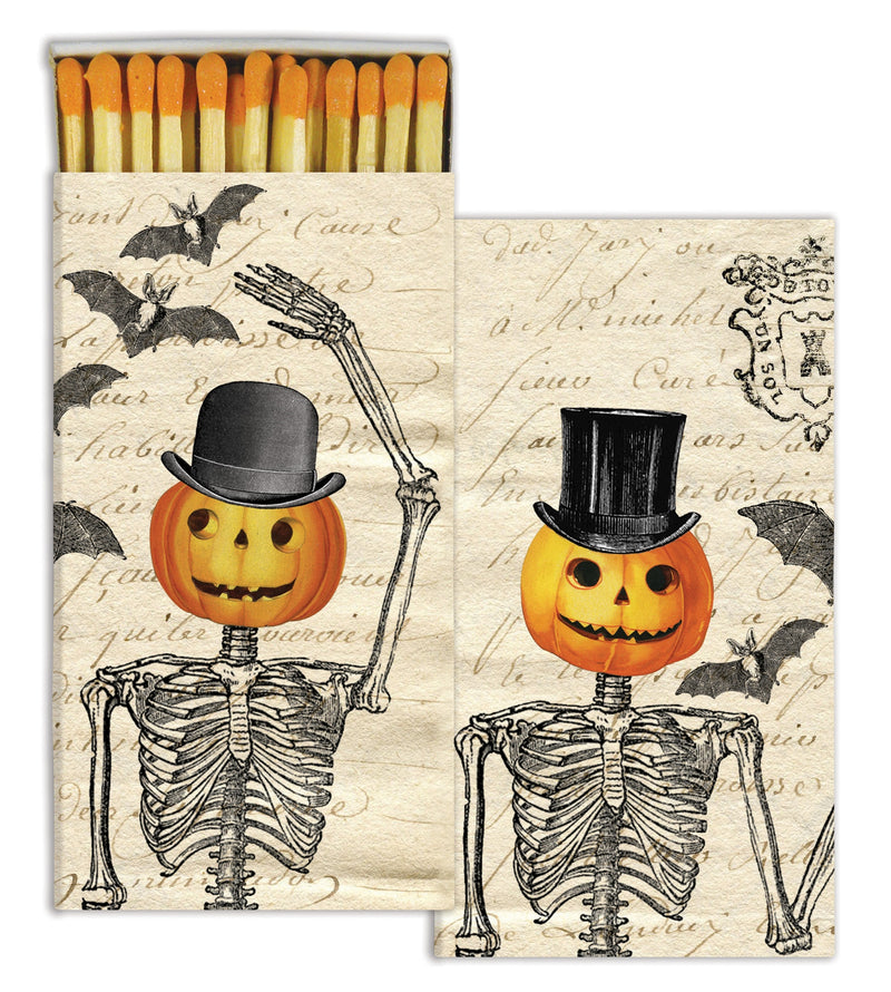 match box with pumpkins wearing a top hat 
